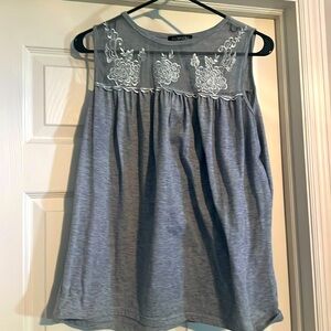 Beautiful sleeveless top with lace detail at top